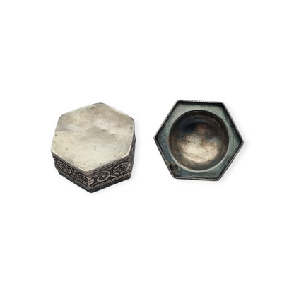 Hexagonal oriental ethnic silver box with floral relief and domed lid, circa 1970