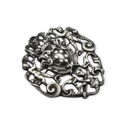 Neo-Renaissance silver brooch, heraldic shield with cherubs Italy 20th century