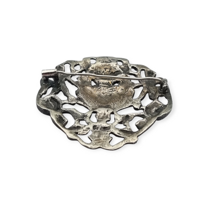 Neo-Renaissance silver brooch, heraldic shield with cherubs Italy 20th century