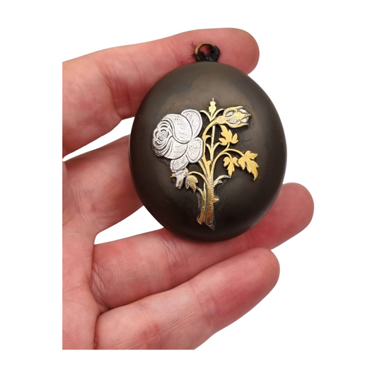 Victorian vulcanite locket, mourning jewelry, raised flower, England circa 1890-1900