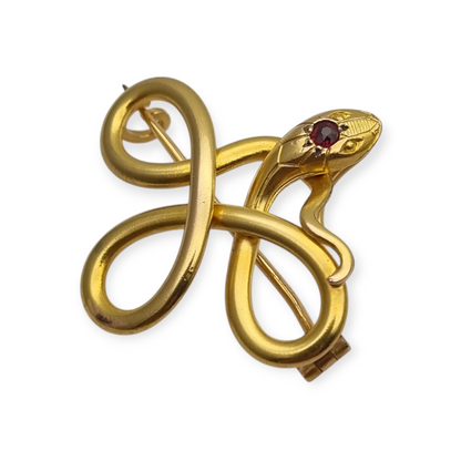 French FIX brooch with intertwined snake, rolled gold and red stone circa 1910