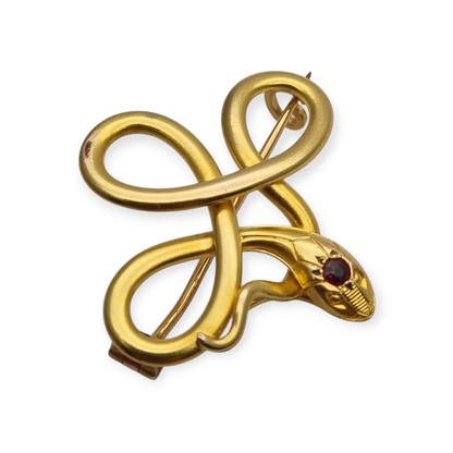 French FIX brooch with intertwined snake, rolled gold and red stone circa 1910