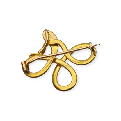 French FIX brooch with intertwined snake, rolled gold and red stone circa 1910