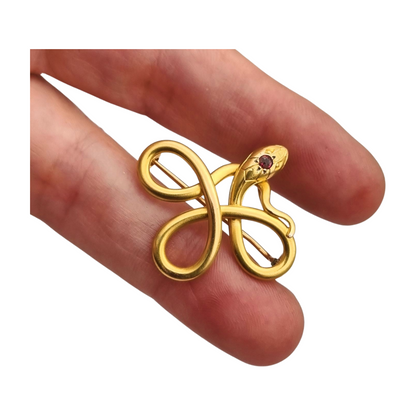 French FIX brooch with intertwined snake, rolled gold and red stone circa 1910