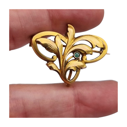 FIX Art Nouveau gold-plated brooch with green stone and floral design, circa 1920