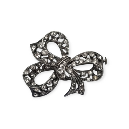 Bisutería antigua broche lazo Art Déco de metal plateado con pedrería, circa 1940-1950