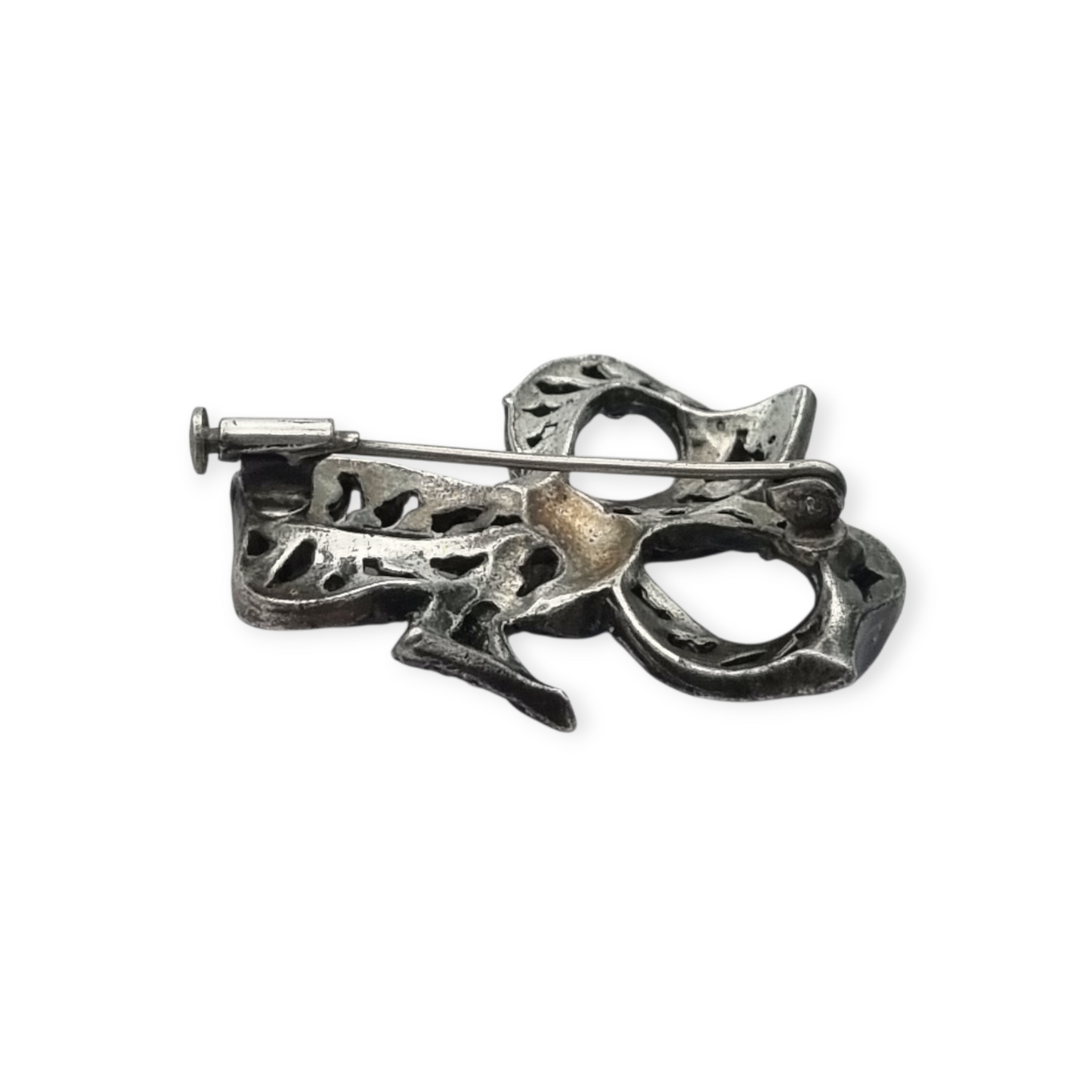 Bisutería antigua broche lazo Art Déco de metal plateado con pedrería, circa 1940-1950