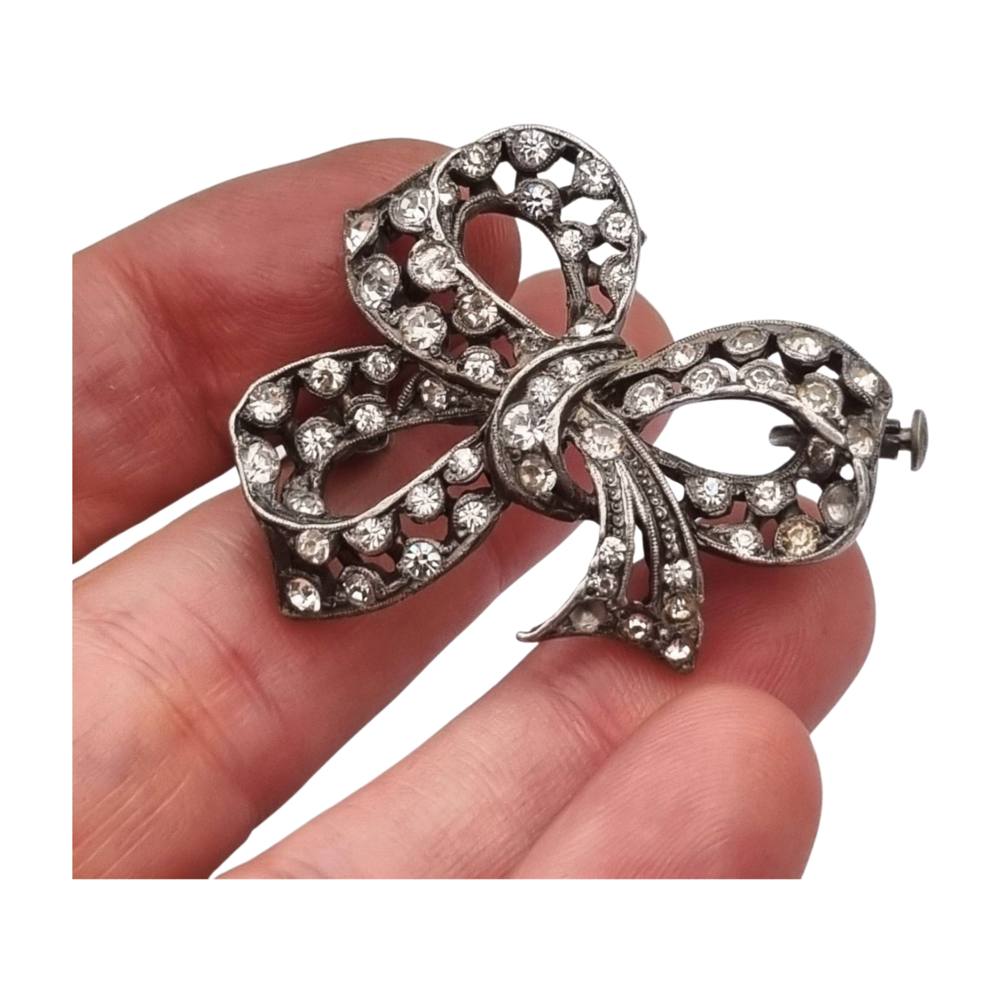 Bisutería antigua broche lazo Art Déco de metal plateado con pedrería, circa 1940-1950