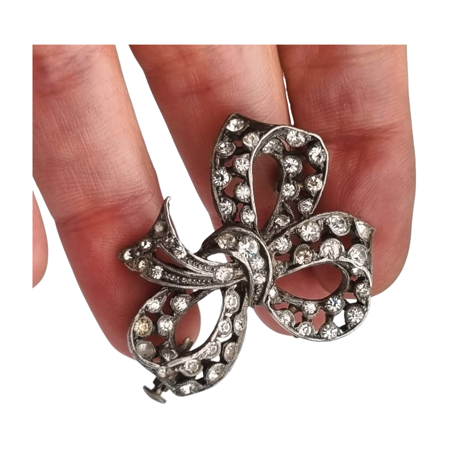 Bisutería antigua broche lazo Art Déco de metal plateado con pedrería, circa 1940-1950