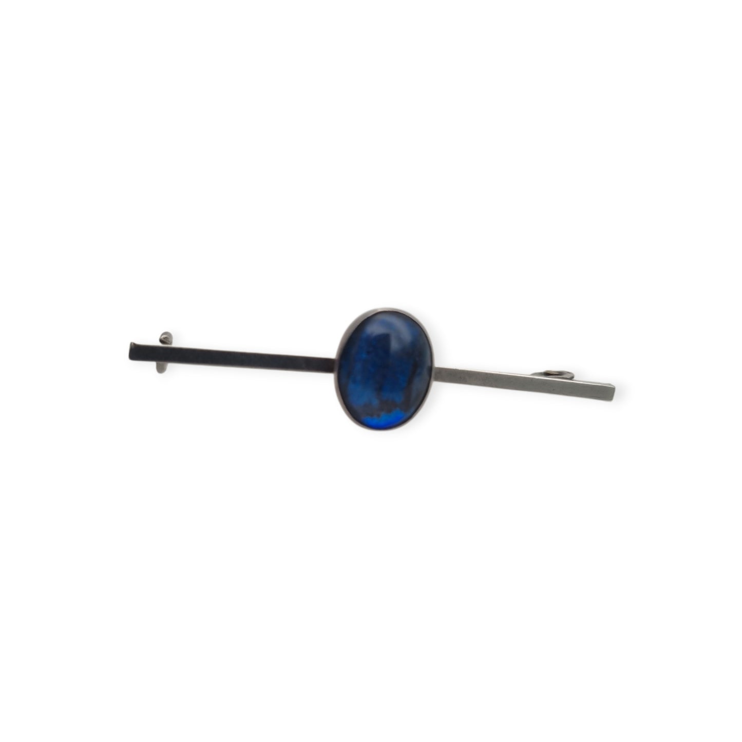 Broche antiguo de plata con cabujón azul ovalado, diseño minimalista siglo XX