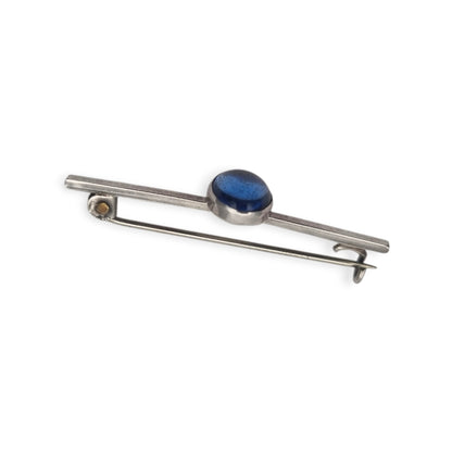 Broche antiguo de plata con cabujón azul ovalado, diseño minimalista siglo XX