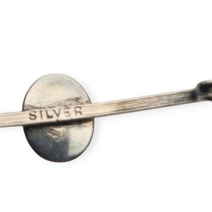 Broche antiguo de plata con cabujón azul ovalado, diseño minimalista siglo XX