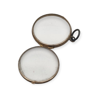 Colgante guardapelo antiguo redondo de metal y cristal biselado, circa 1920