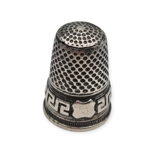 European silver thimble with geometric fretwork decoration and plain cartouche circa 1960
