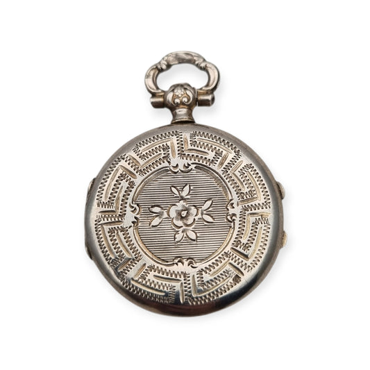 Guardapelo victoriano en plata con grabado floral Europeo, circa 1910