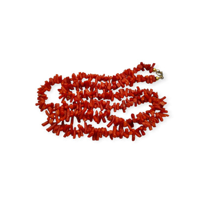 Boho necklace of natural red coral with irregular branches and metal clasp, circa 1970-80