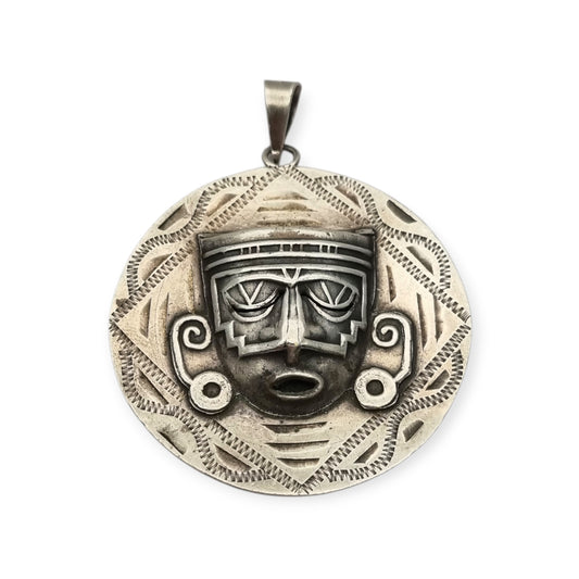 Reversible .925 sterling silver Aztec calendar and mask pendant, Mexico, 1960s-70s