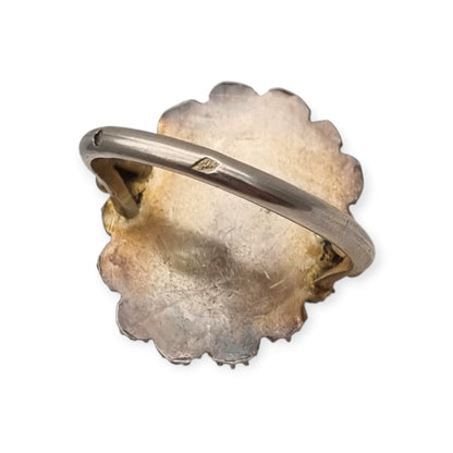 Mid-Century silver ring with blue cabochon and highly ornate floral frame, 1960