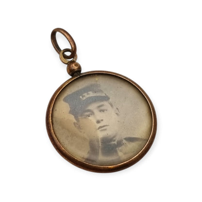 Circular gilded metal and glass locket, antique photo holder, c. 1900