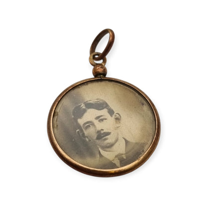 Circular gilded metal and glass locket, antique photo holder, c. 1900