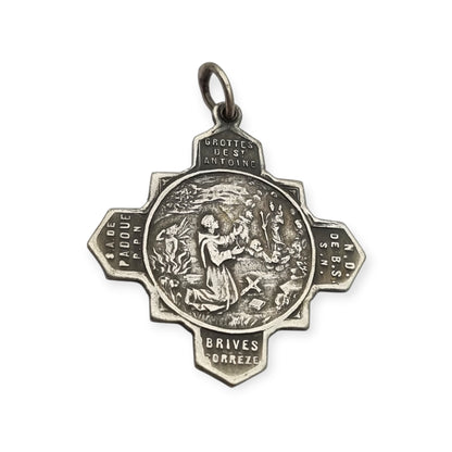 Catholic devotional silver-tone metal Saint Anthony of Padua cross medal, circa 1970