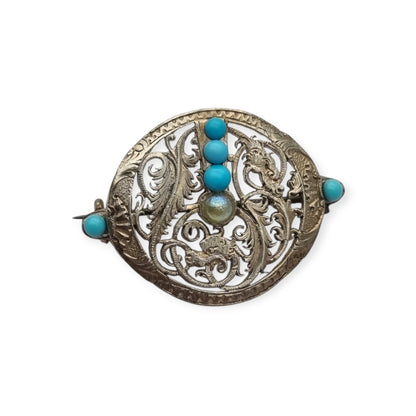 Broche vintage boho étnico de plata con cuentas azules y calado vegetal, años 70-80