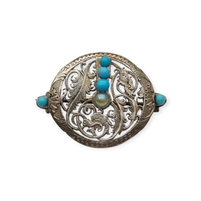 Broche vintage boho étnico de plata con cuentas azules y calado vegetal, años 70-80