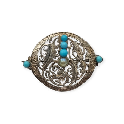 Broche vintage boho étnico de plata con cuentas azules y calado vegetal, años 70-80