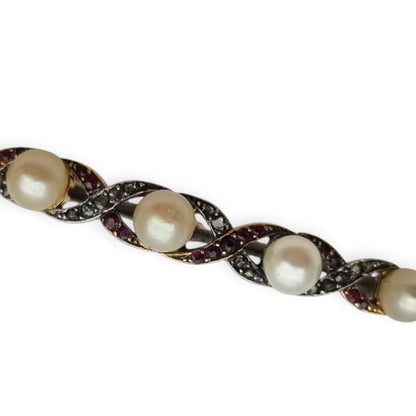 Belle Époque brooch in 14k gold and white metal with pearls, rubies and white sapphires circa 1900