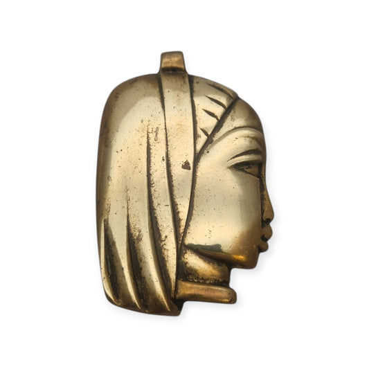 Gran colgante escultórico de bronce con cabeza femenina estilizada, circa 1980-1990