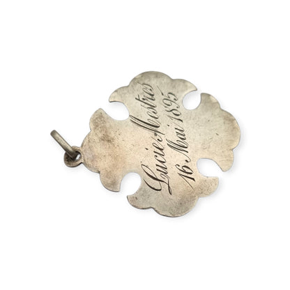 Medalla religiosa antigua de Primera Comunión en plata con cáliz, espigas e inscripción de 1895