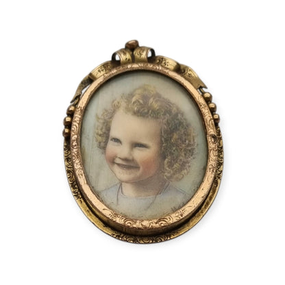 Belle Époque gilded metal locket brooch with Louis XV style miniature child portrait, circa 1890-1910
