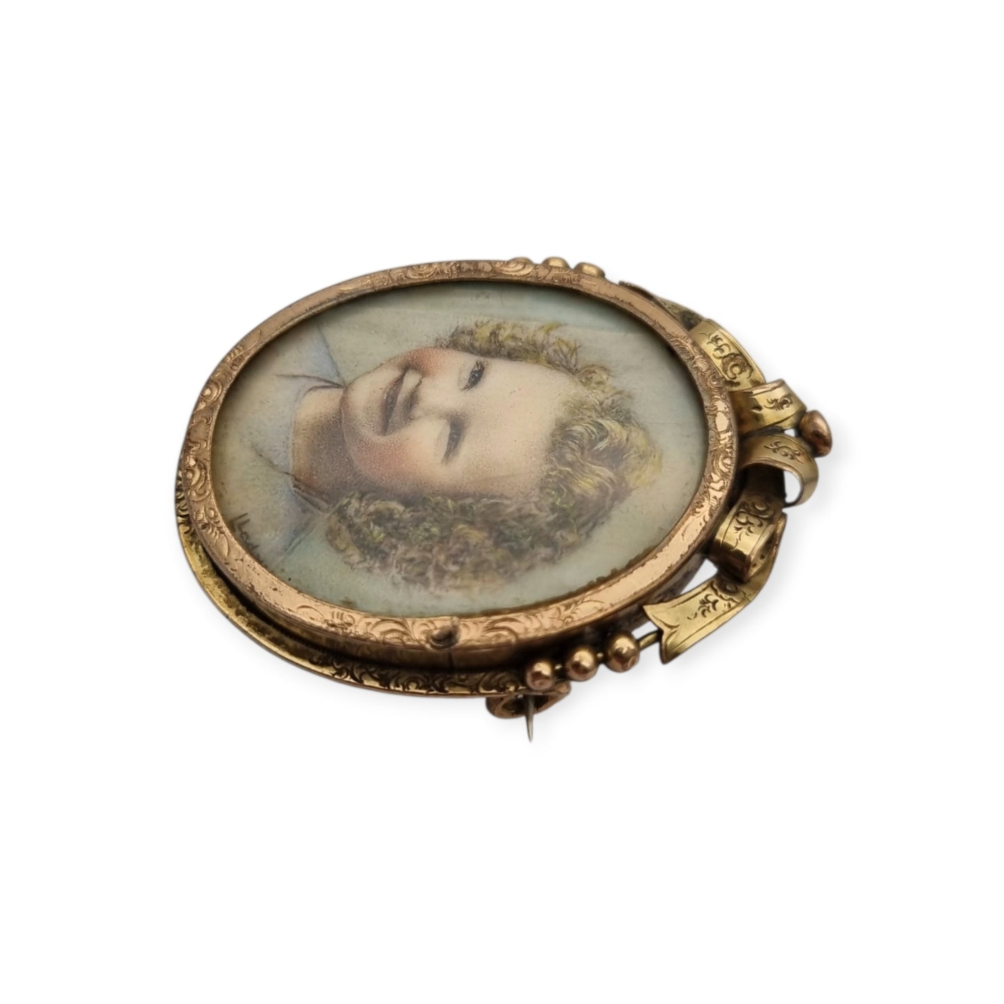 Belle Époque gilded metal locket brooch with Louis XV style miniature child portrait, circa 1890-1910