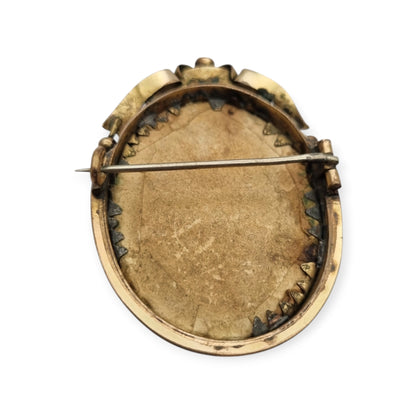 Belle Époque gilded metal locket brooch with Louis XV style miniature child portrait, circa 1890-1910