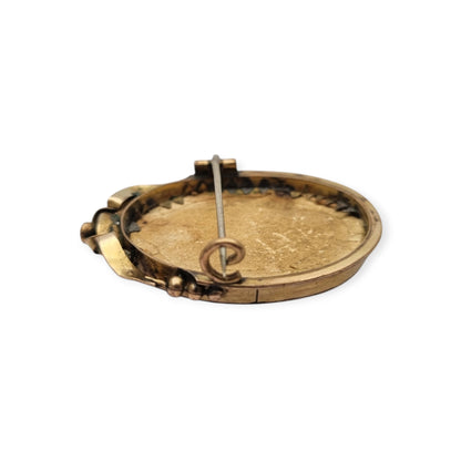 Belle Époque gilded metal locket brooch with Louis XV style miniature child portrait, circa 1890-1910