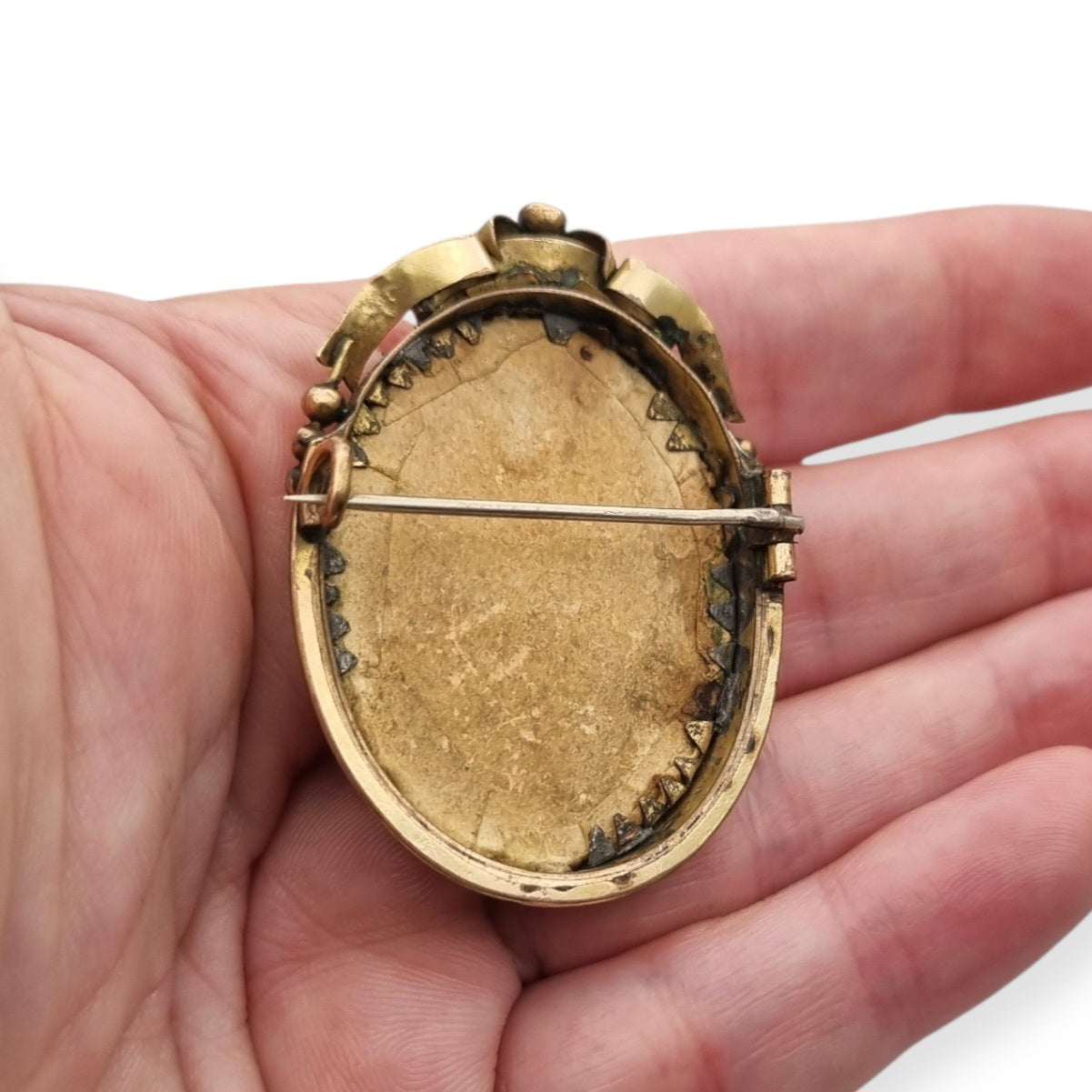 Belle Époque gilded metal locket brooch with Louis XV style miniature child portrait, circa 1890-1910