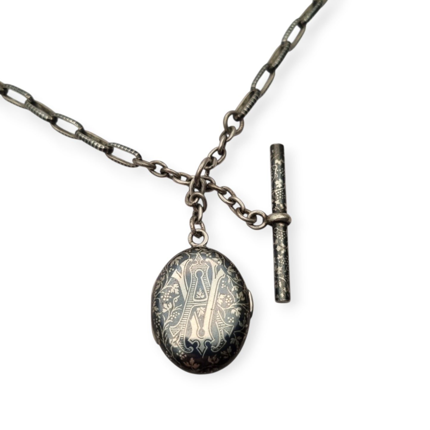 Antigua Cadena Albert completa de plata nielada para reloj de bolsillo con guardapelo monogramado  circa 1890