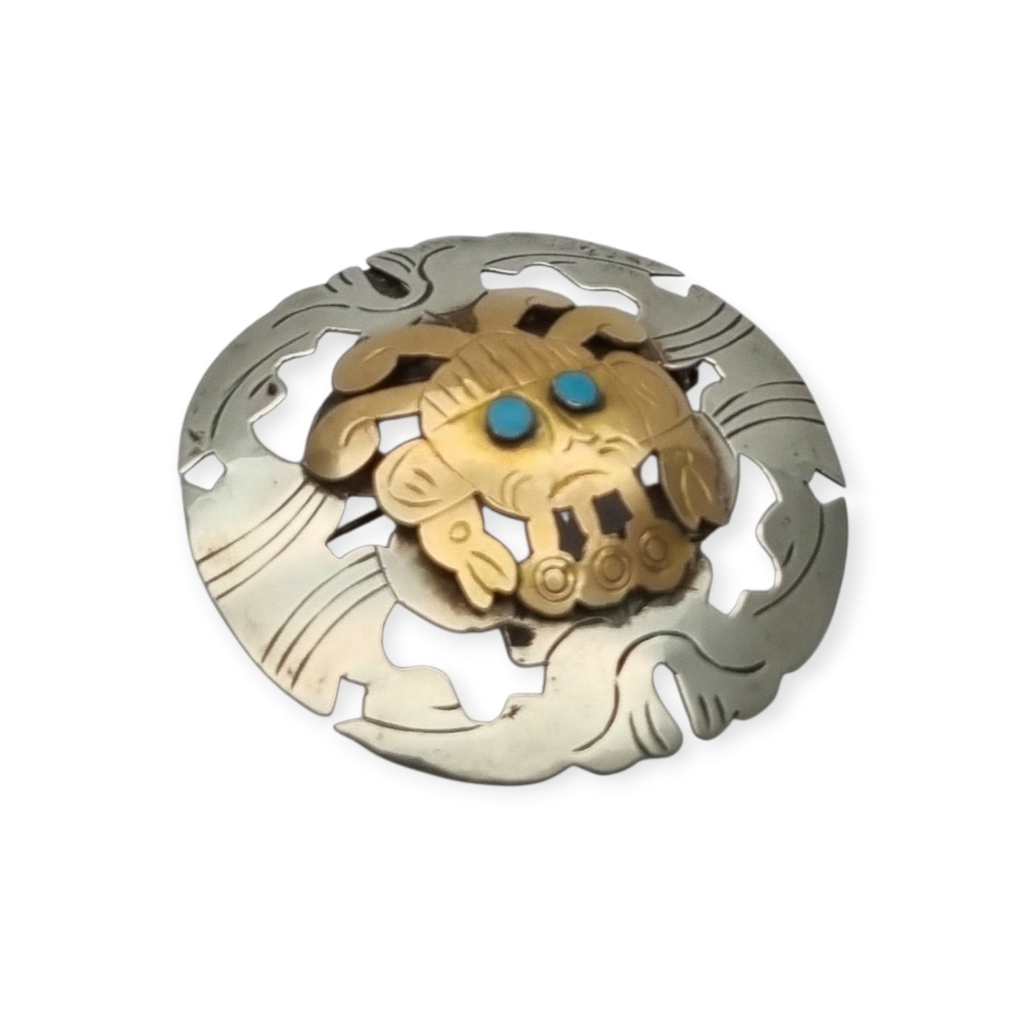 Broche colgante peruano de plata 925 y oro 18K con máscara precolombina y cabujones de turquesa, circa 1965–1975