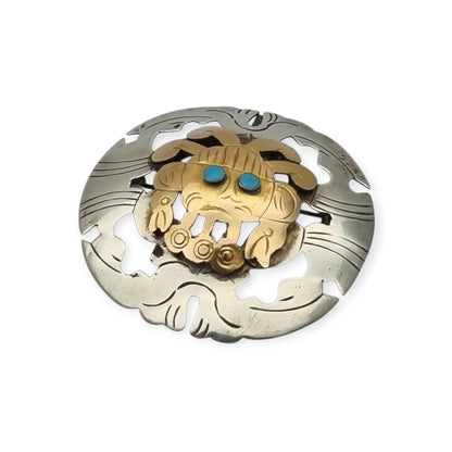 Broche colgante peruano de plata 925 y oro 18K con máscara precolombina y cabujones de turquesa, circa 1965–1975