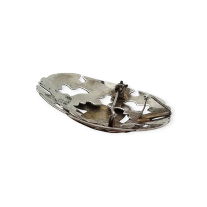 Broche colgante peruano de plata 925 y oro 18K con máscara precolombina y cabujones de turquesa, circa 1965–1975
