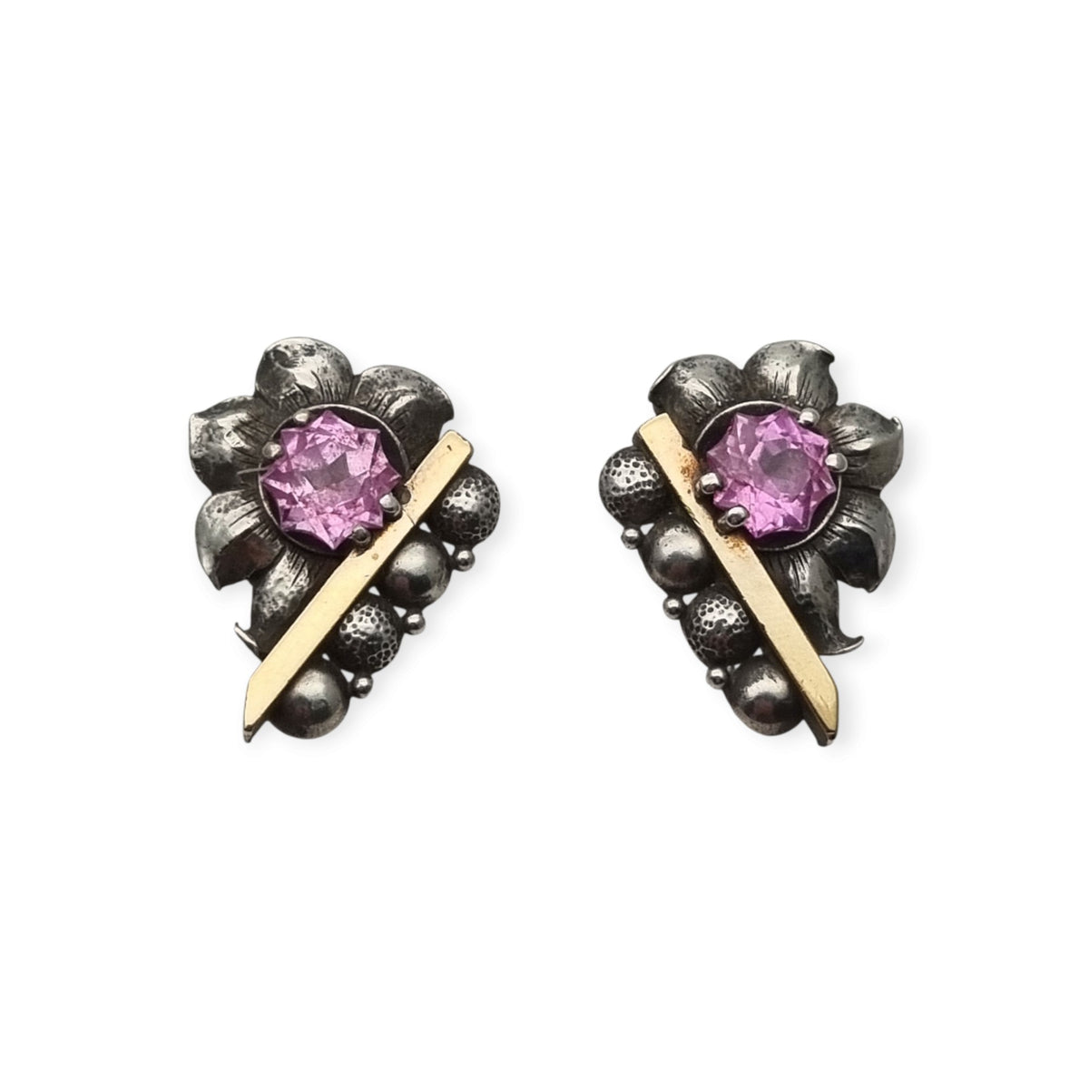 Art Deco silver earrings with gold accents and faceted pink stones, circa 1930–1940