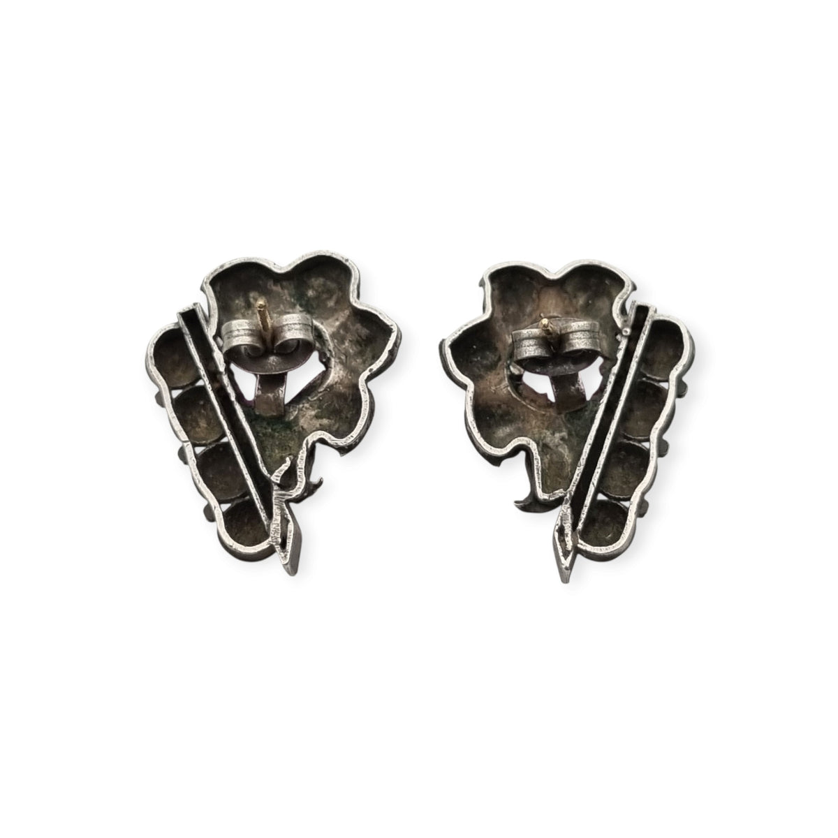 Art Deco silver earrings with gold accents and faceted pink stones, circa 1930–1940