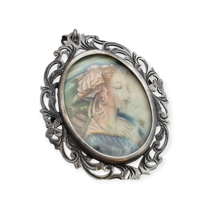 Broche colgante Art Nouveau de plata 800 con miniatura de dama y marco floral, Europa, ca. 1900–1930