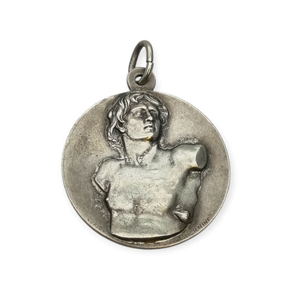 Vintage relic medal of Saint Sebastian from the Catacombs of Rome with early Christian symbols, Italy, ca. 1950–1960