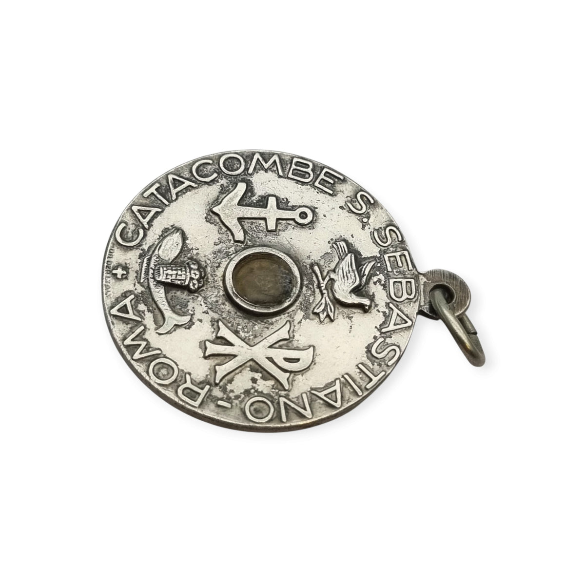 Vintage relic medal of Saint Sebastian from the Catacombs of Rome with early Christian symbols, Italy, ca. 1950–1960