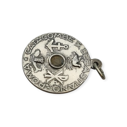 Vintage relic medal of Saint Sebastian from the Catacombs of Rome with early Christian symbols, Italy, ca. 1950–1960