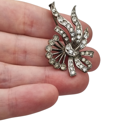 Antique Art Deco silver brooch with floral bouquet and white rhinestone bow circa 1930
