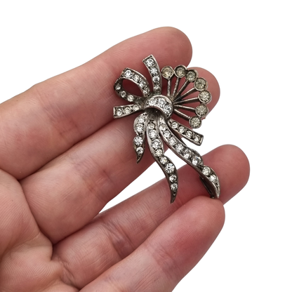 Antique Art Deco silver brooch with floral bouquet and white rhinestone bow circa 1930