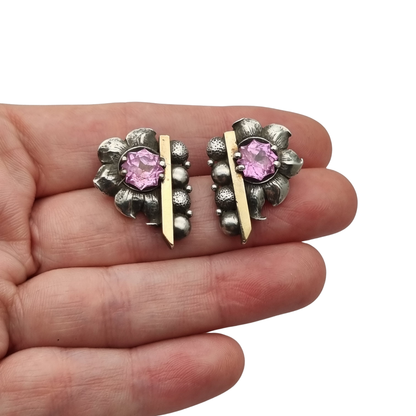 Art Deco silver earrings with gold accents and faceted pink stones, circa 1930–1940
