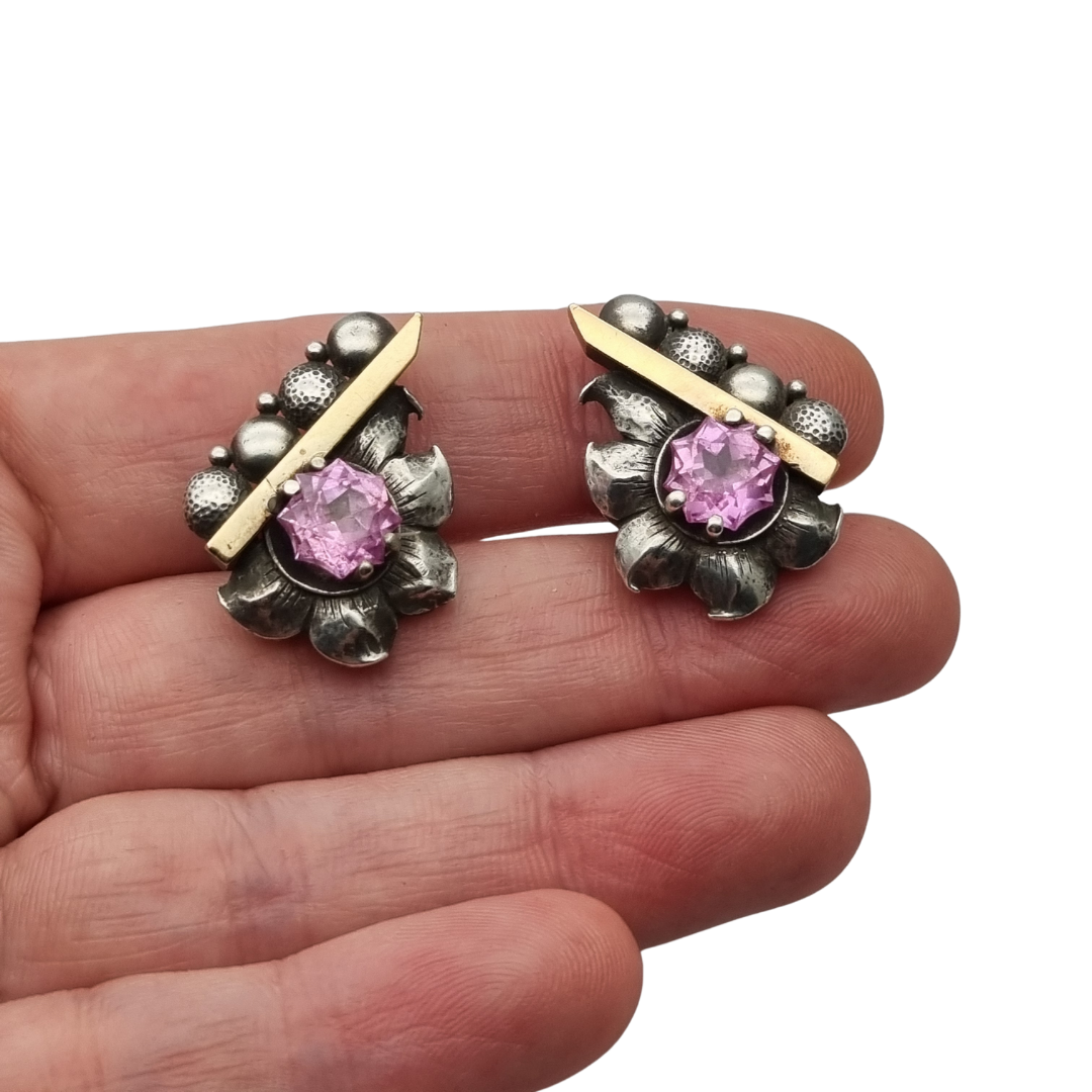 Art Deco silver earrings with gold accents and faceted pink stones, circa 1930–1940